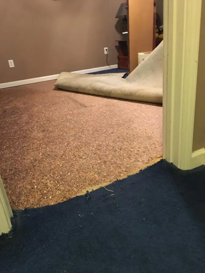 Carpet pad removal revealing water damage during Drying & Dehumidification in Tehaleh